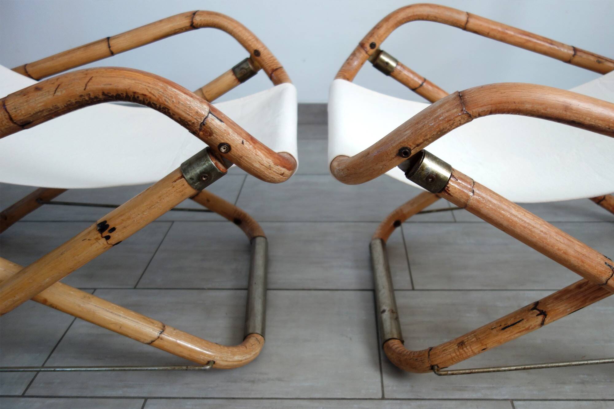 Pair of folding bamboo and brass deck chairs, Italy, 1960s.