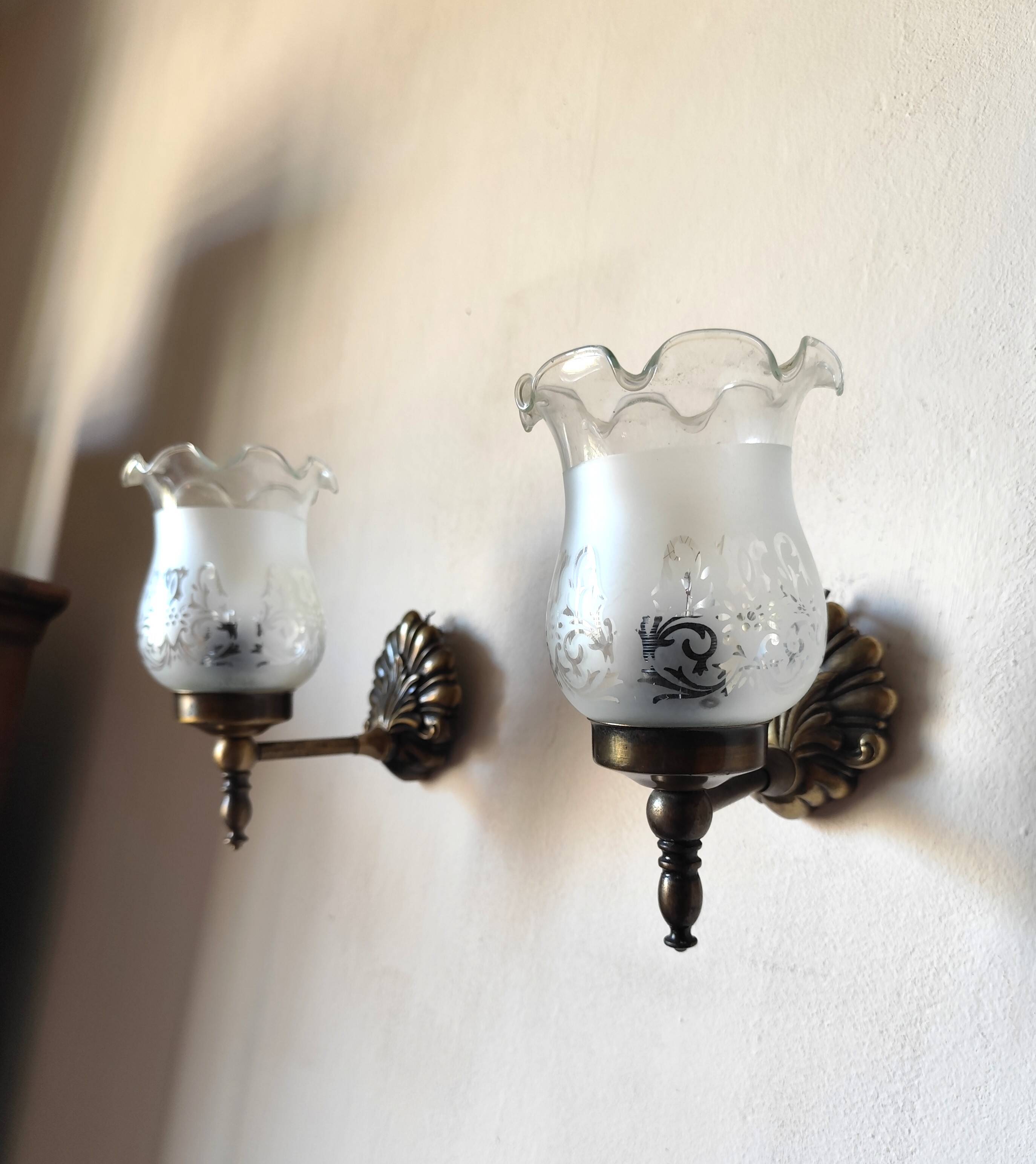 Pair of wall sconces in bronze with opaline glass tulips.