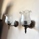 Pair of wall sconces in bronze with opaline glass tulips.
