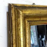 19th century mercury mirror with wooden frame and gilded stucco