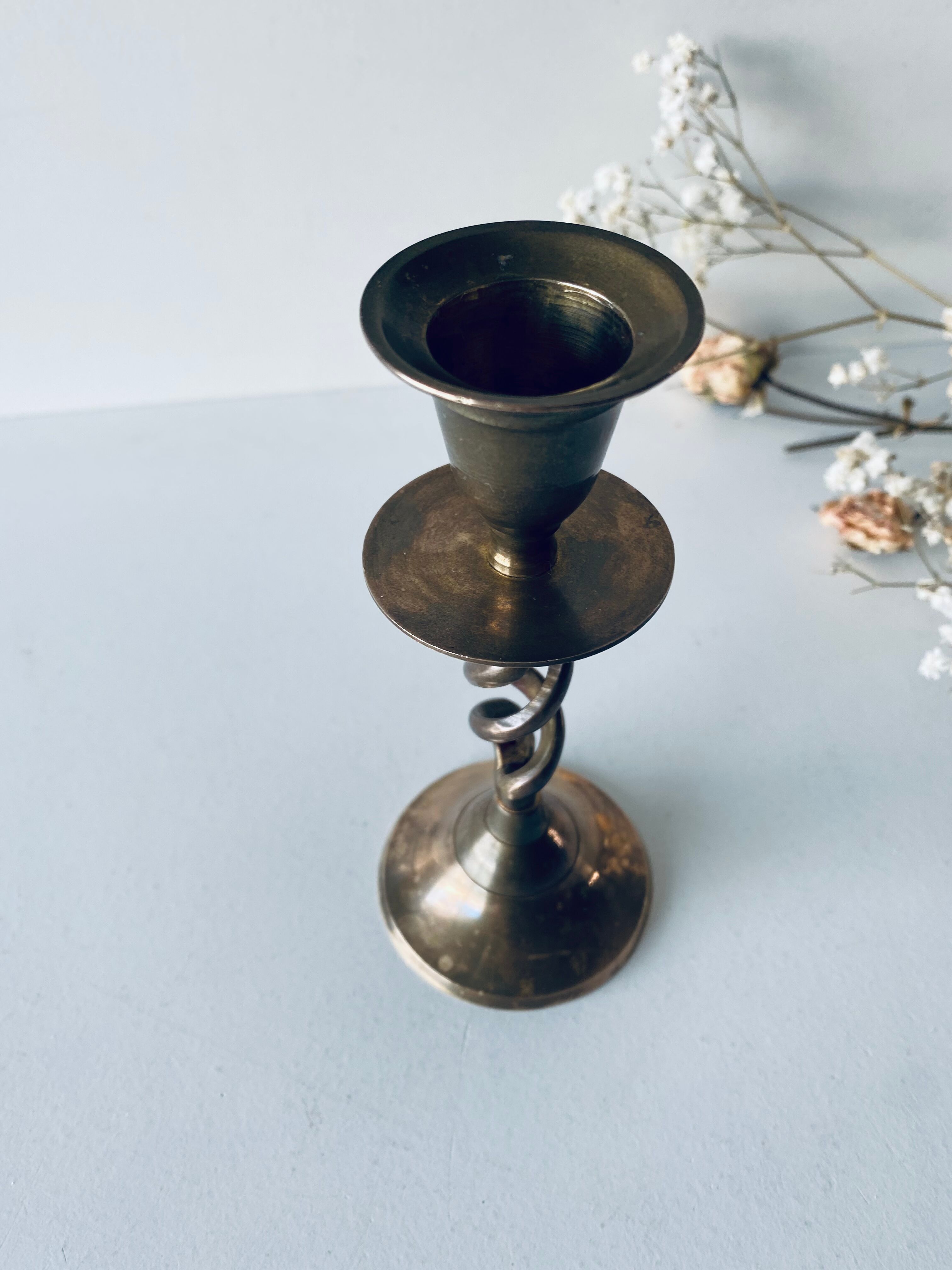 Twisted brass candle holder