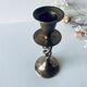 Twisted brass candle holder