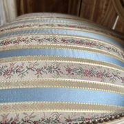Pair of Louis XVI style chairs in painted wood and satin, classic elegance.