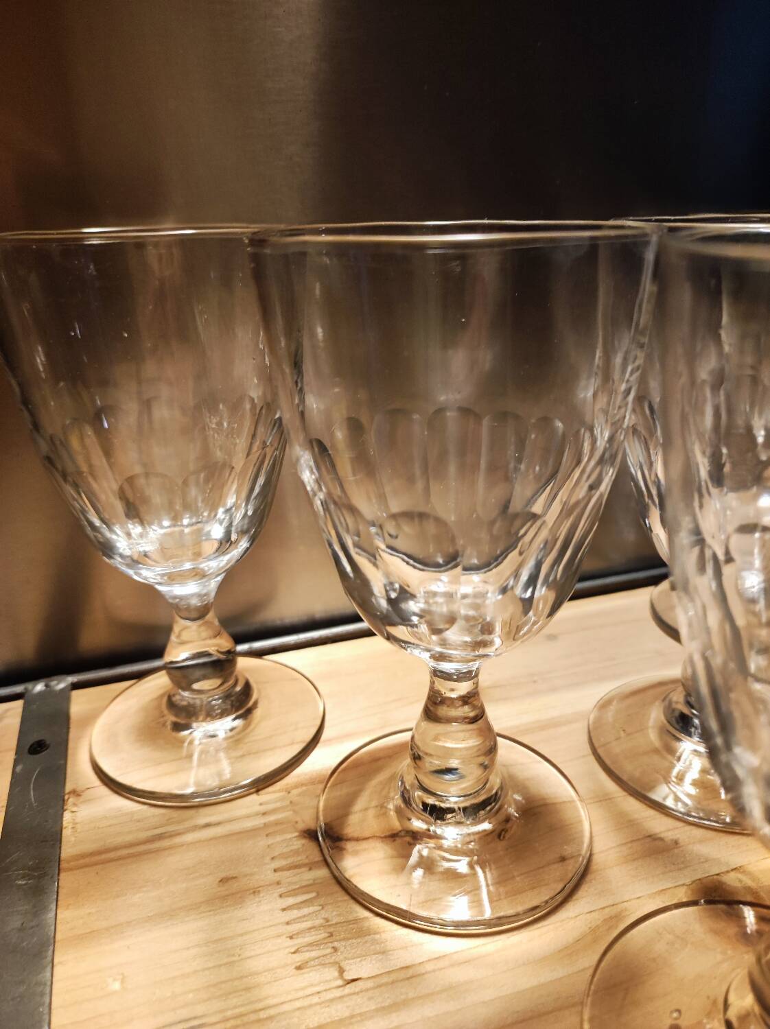 5 antique wine glasses with cut sides