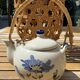 Vintage ceramic tea set for 6 bowls and a teapot.