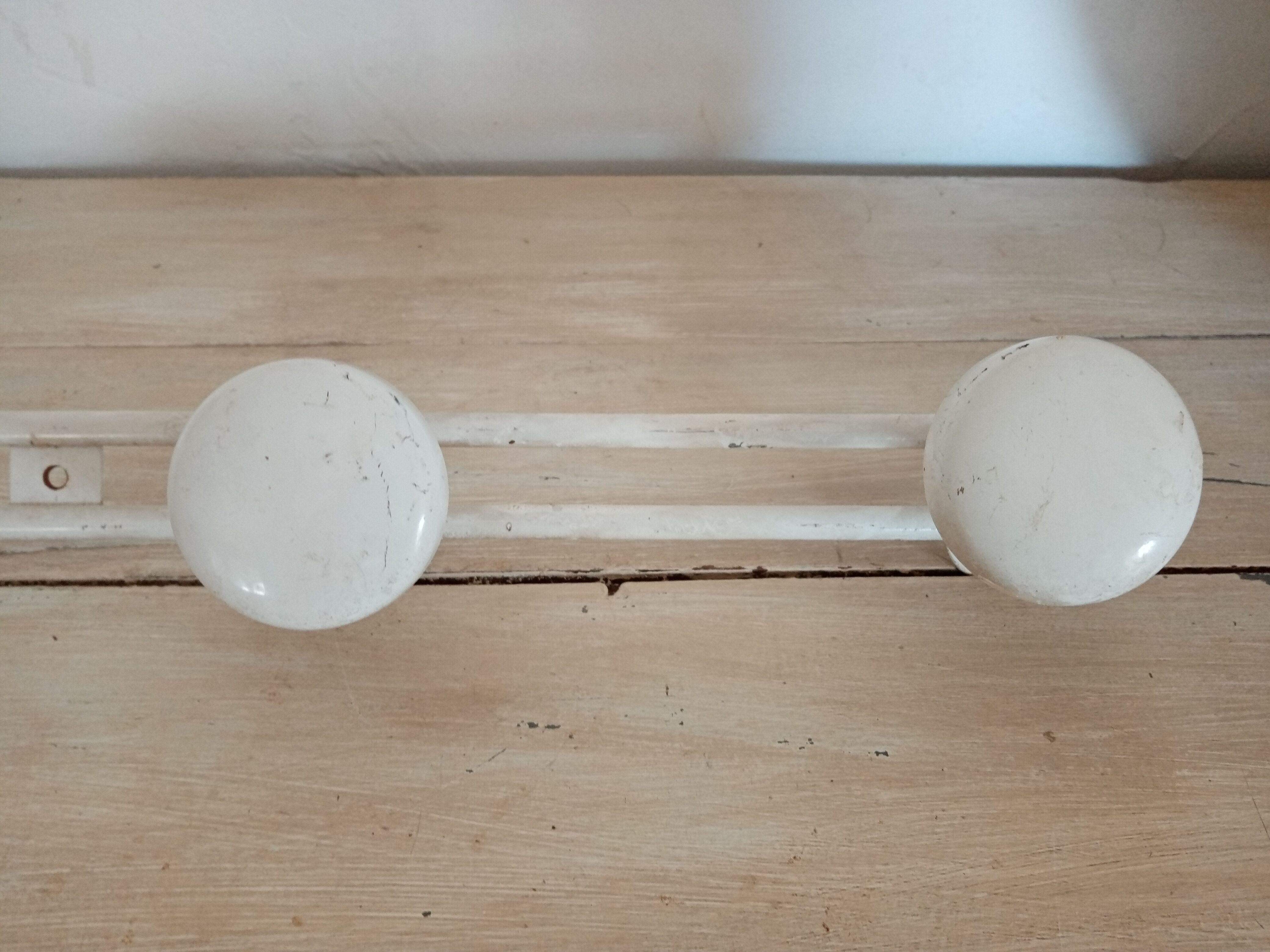 Metal wall coat holder