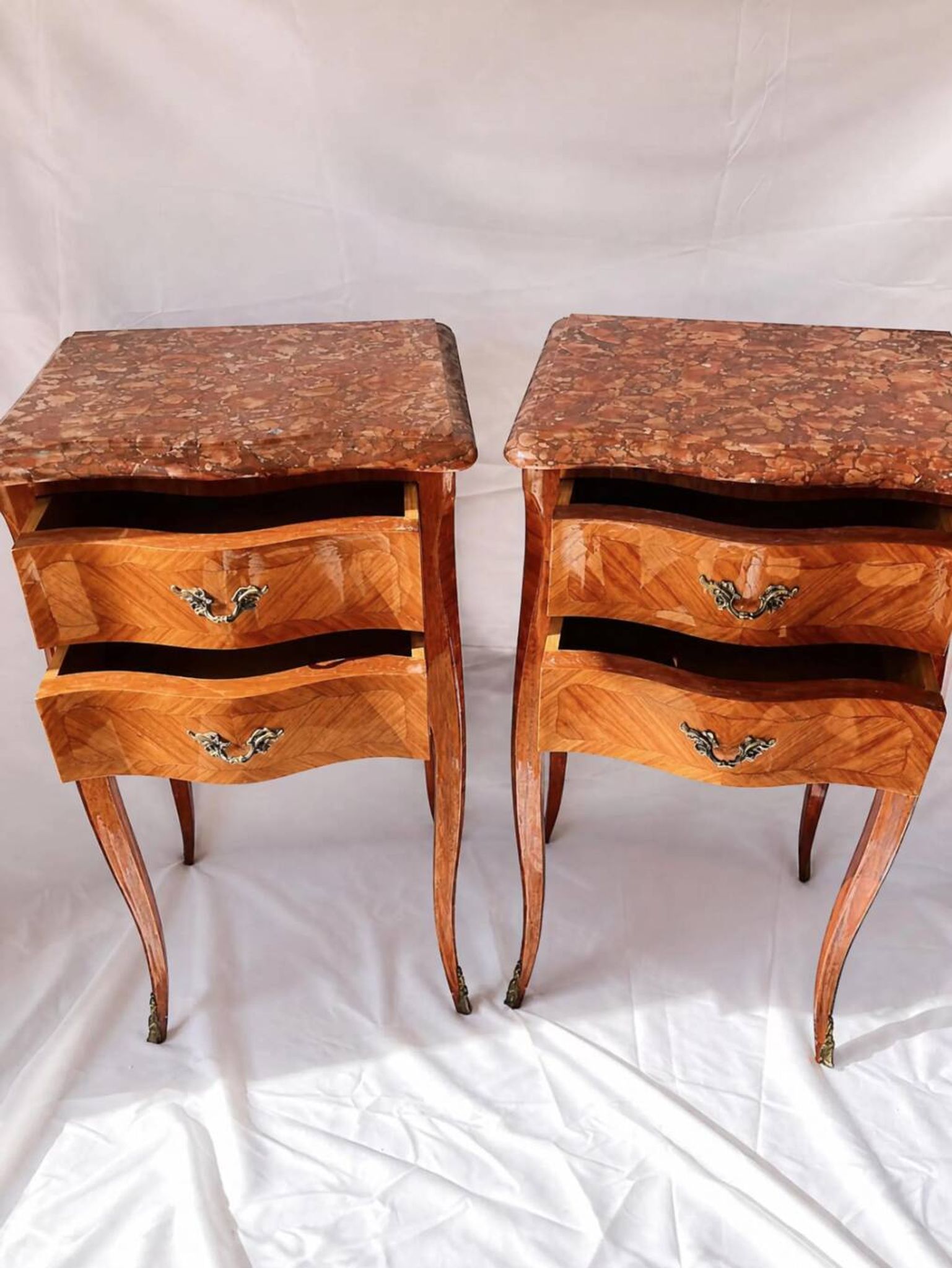 Pair of French rosewood bedside tables, marble top, inlaid beds.