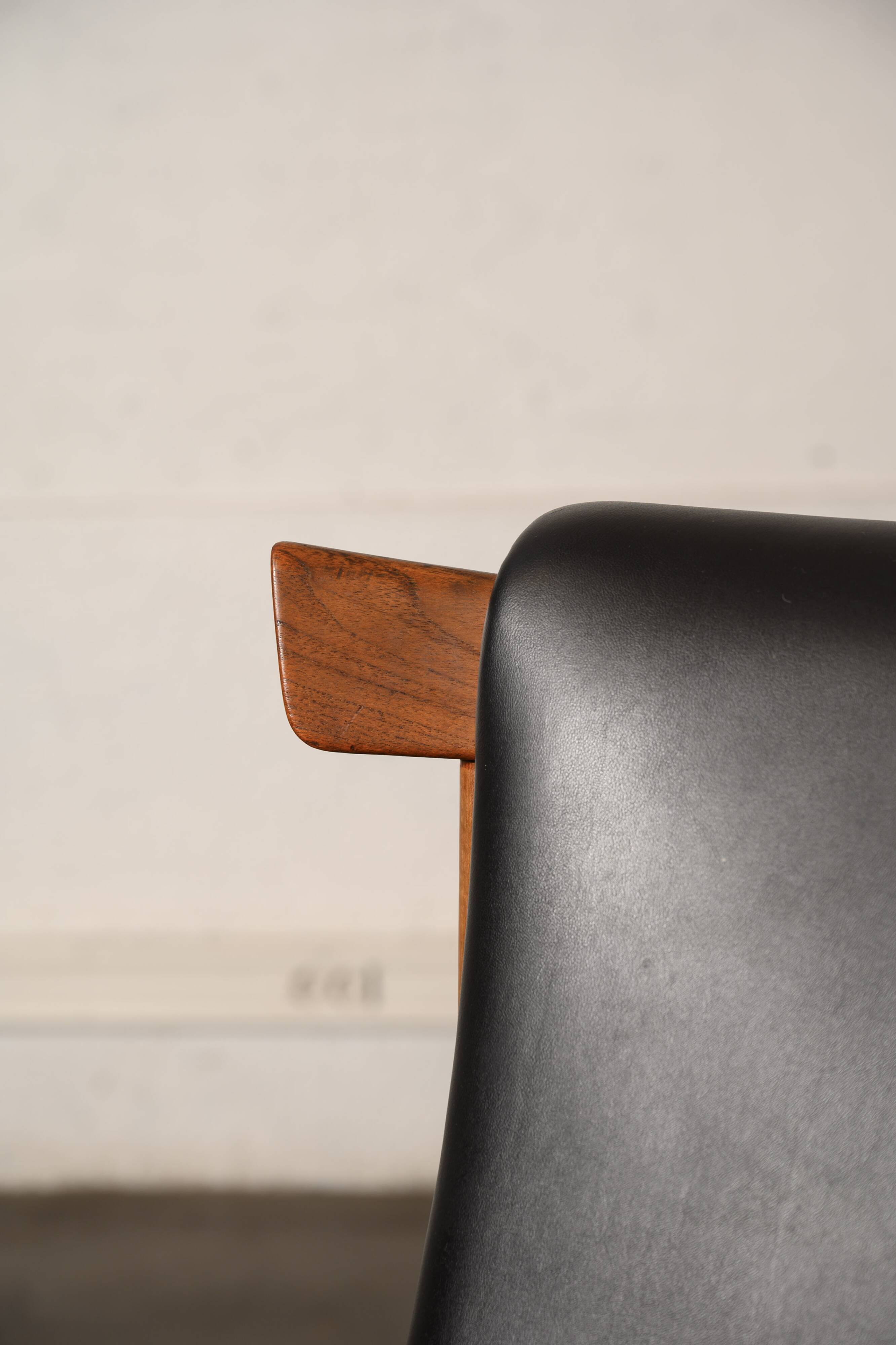 Finished Juhl armchair and its ottoman.