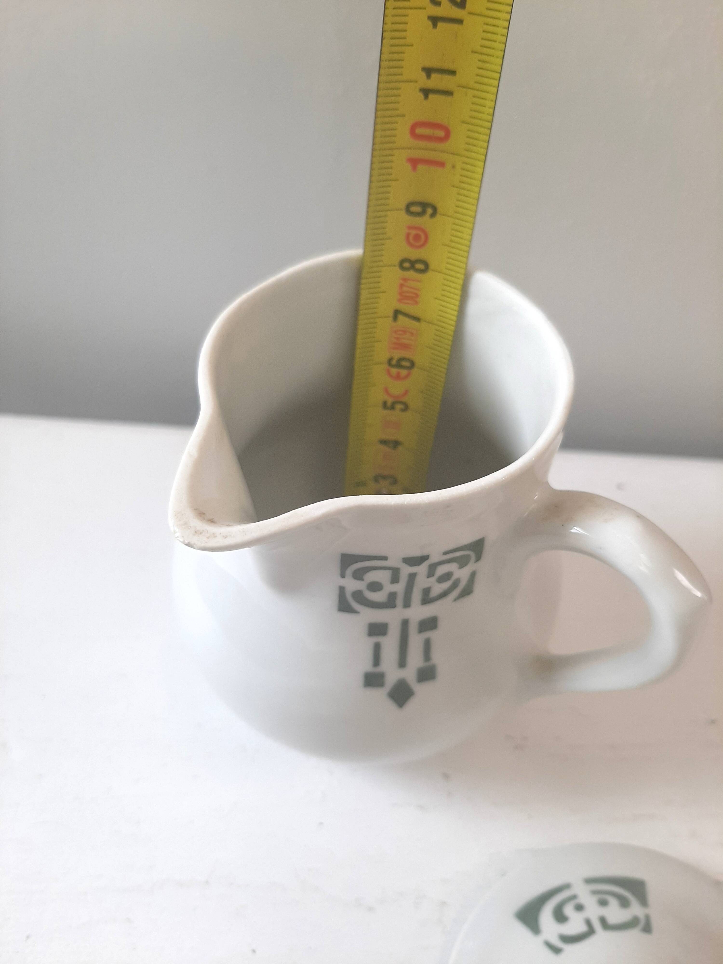 Vintage cream pot with Art Deco pattern and its lid.