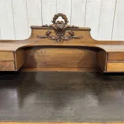 Louis XVI style desk from the late 19th century in walnut with a leather top.