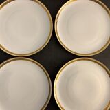 7 flat plates in porcelain of Limoges Bernardaud, decoration of golden Greek, XXth century