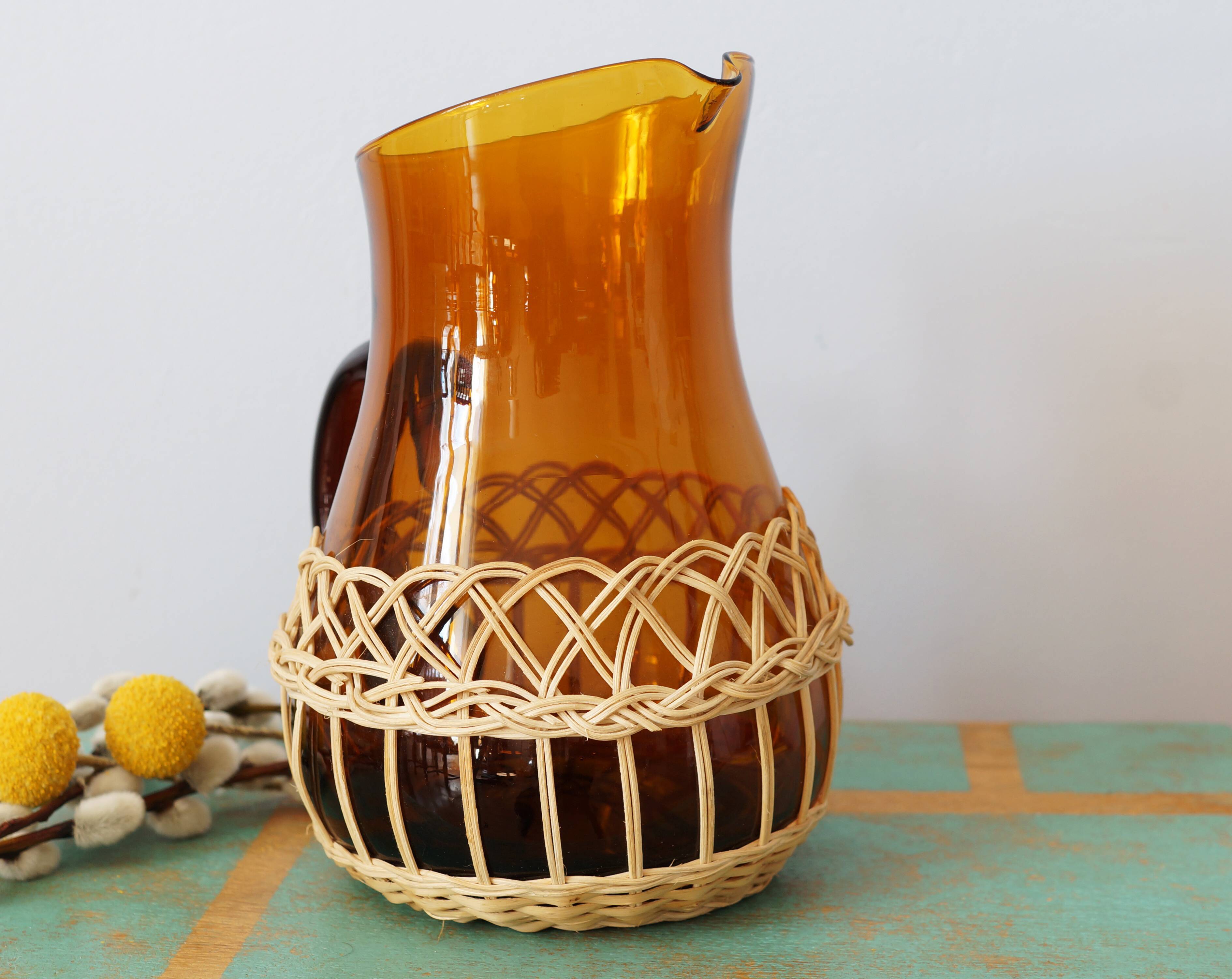 Amber glass decanter dressed in wicker, vintage