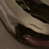 Black ceramic ashtray left hand