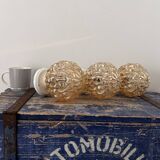 Trio of golden globe wall or ceiling lights