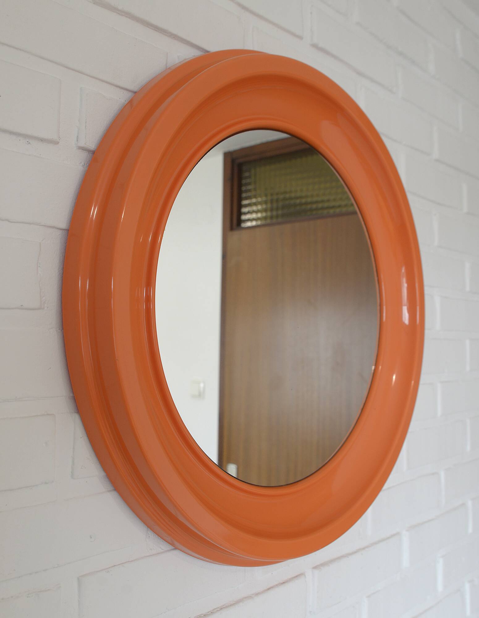 Orange vintage round wall plastic mirror 1980s, space age vanity mirror