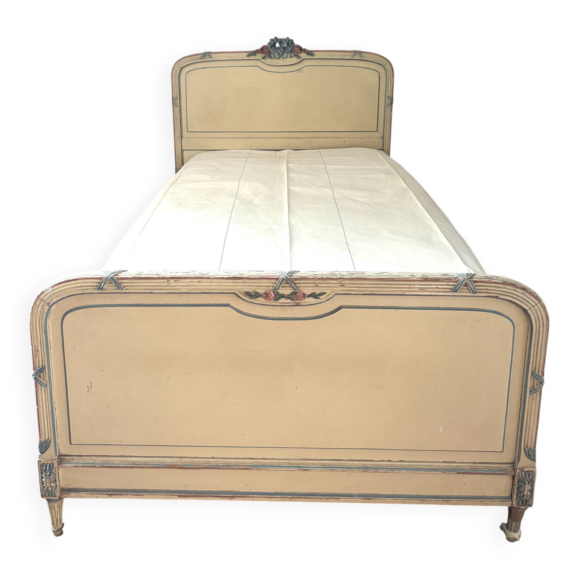 Carved and painted wooden bed