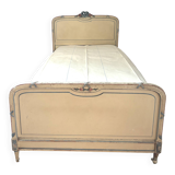 Carved and painted wooden bed