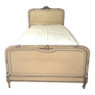 Carved and painted wooden bed