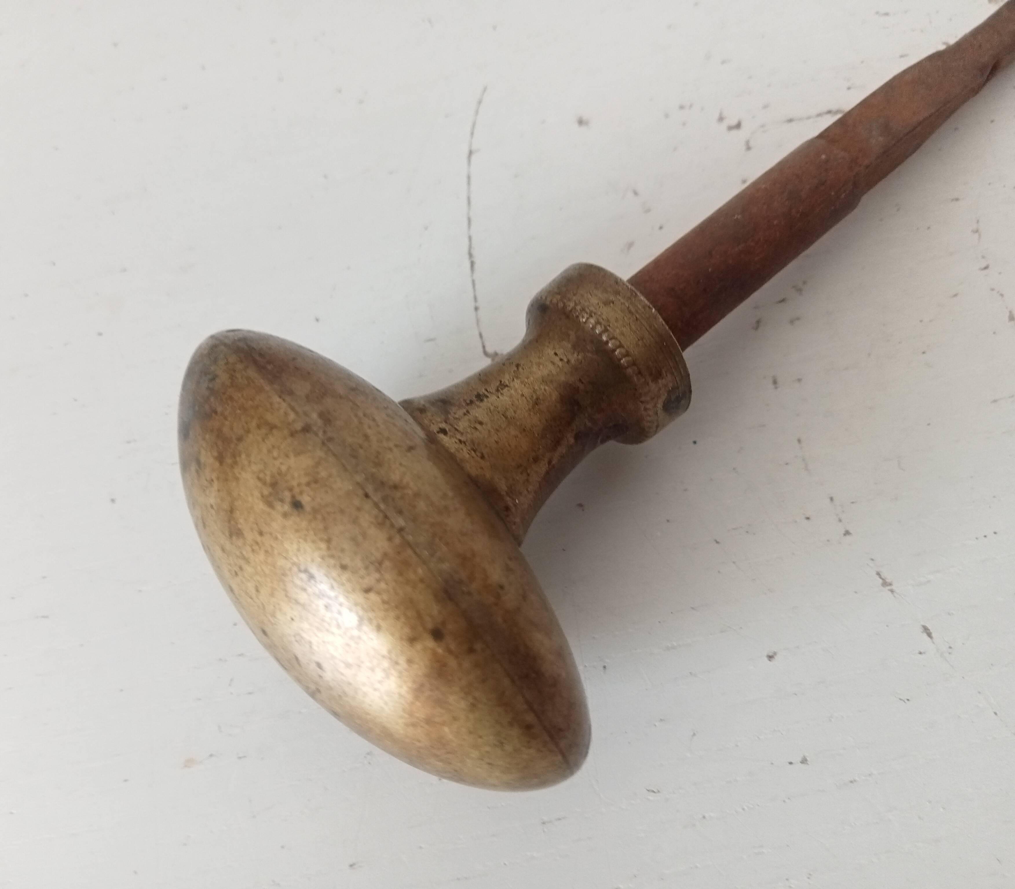 Antique olive door handle from the 19th century.