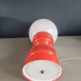 Vintage globe lamp with a metal base, perforated and lacquered in red.