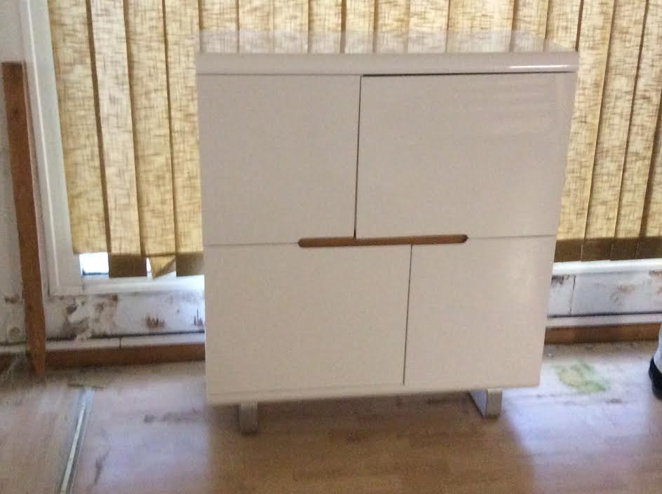 High furniture in white lacquered wood