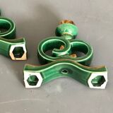 Green and gold candle holders in glazed ceramic