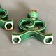 Green and gold candle holders in glazed ceramic