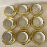 Yellow and white cups and saucers with gold trim Moulin des loups