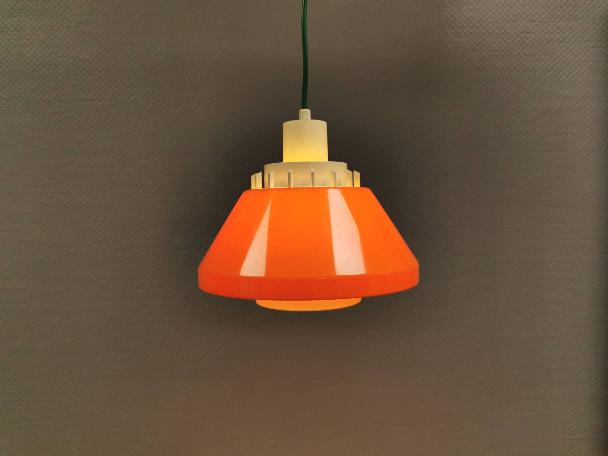 An orange pendant lamp made from hard-pressed ABS plastic. Denmark 1970s