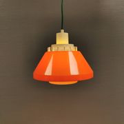 An orange pendant lamp made from hard-pressed ABS plastic. Denmark 1970s