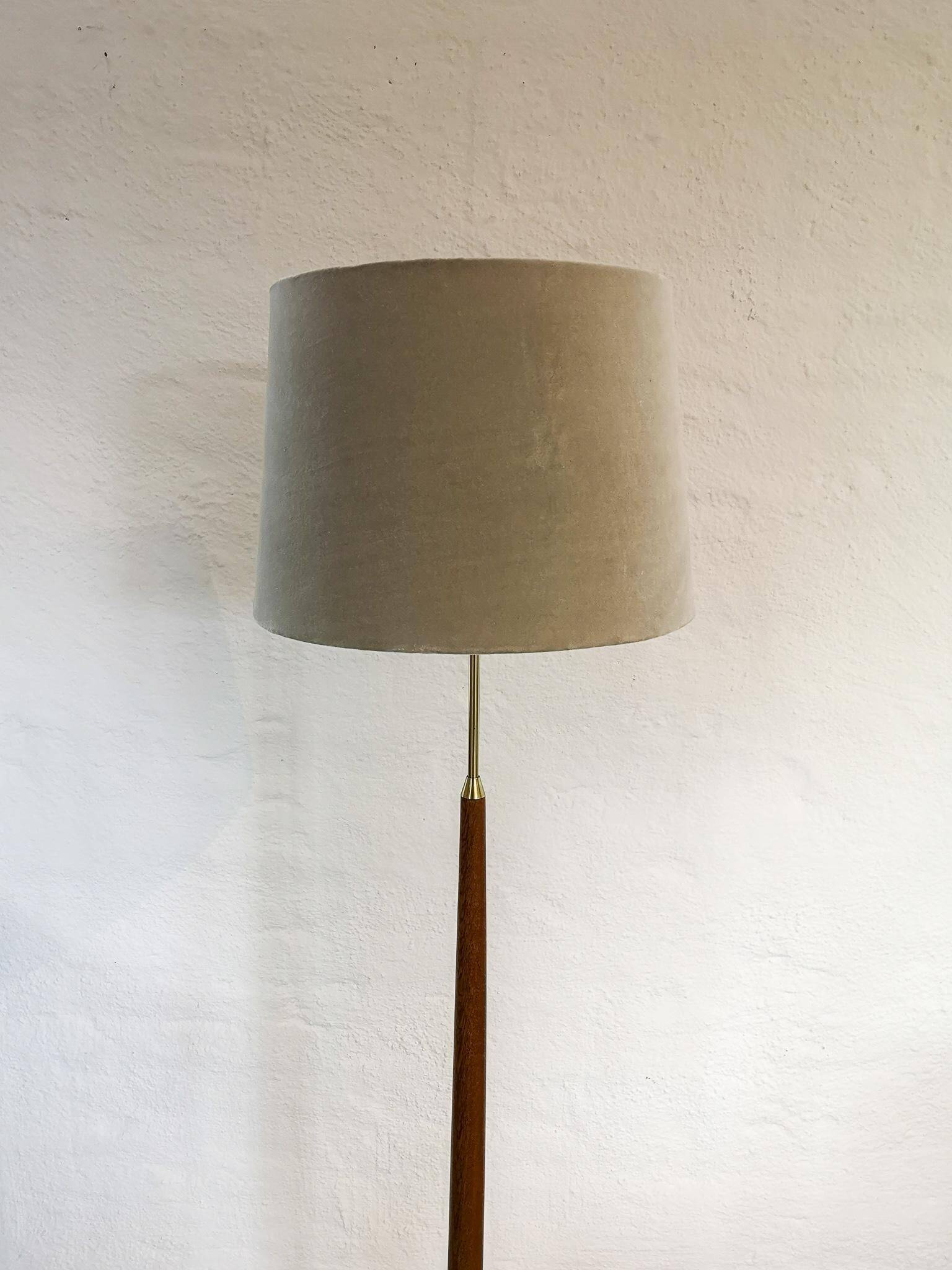 Mid-century floor lamp in teak and brass by Falkenbergs Belysning, Sweden, 1960s.