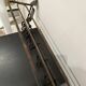 Large antique wall-mounted coat rack in wrought iron.