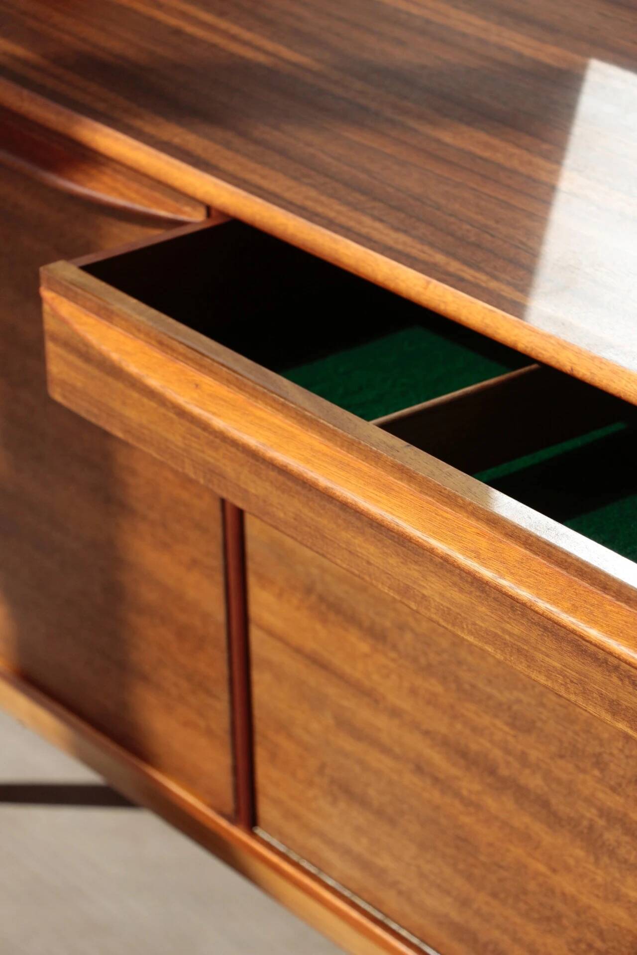 Vintage zebrano and walnut furniture from Morris of Glasgow.