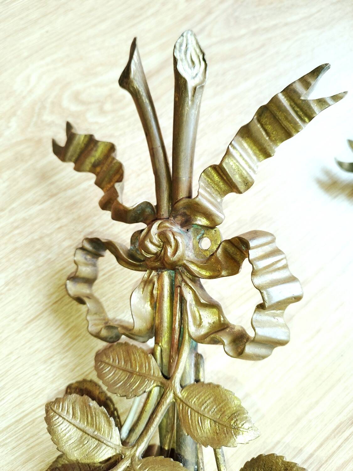 Pair of bronze and gilded metal wall sconces in the Louis XVI style.