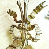 Pair of bronze and gilded metal wall sconces in the Louis XVI style.