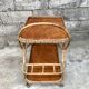 Rolling dessert in woven wicker bamboo rattan with 1950 bottle holder