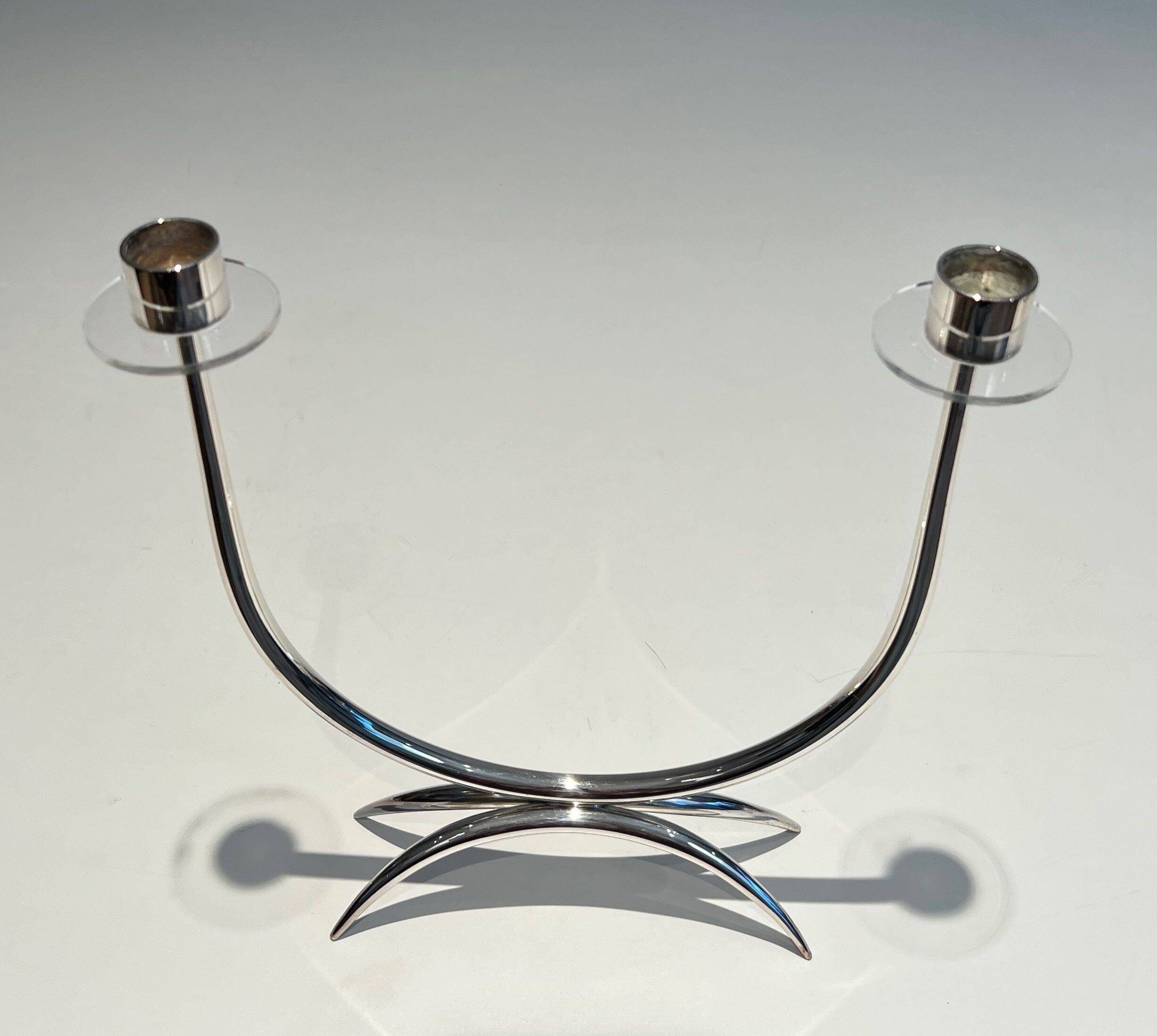 Silver-plated metal and plexiglass design candlestick.