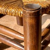 Low fireplace chair attributed to Charles Dudouyt.