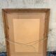 Antique mirror in patinated gilt wood
