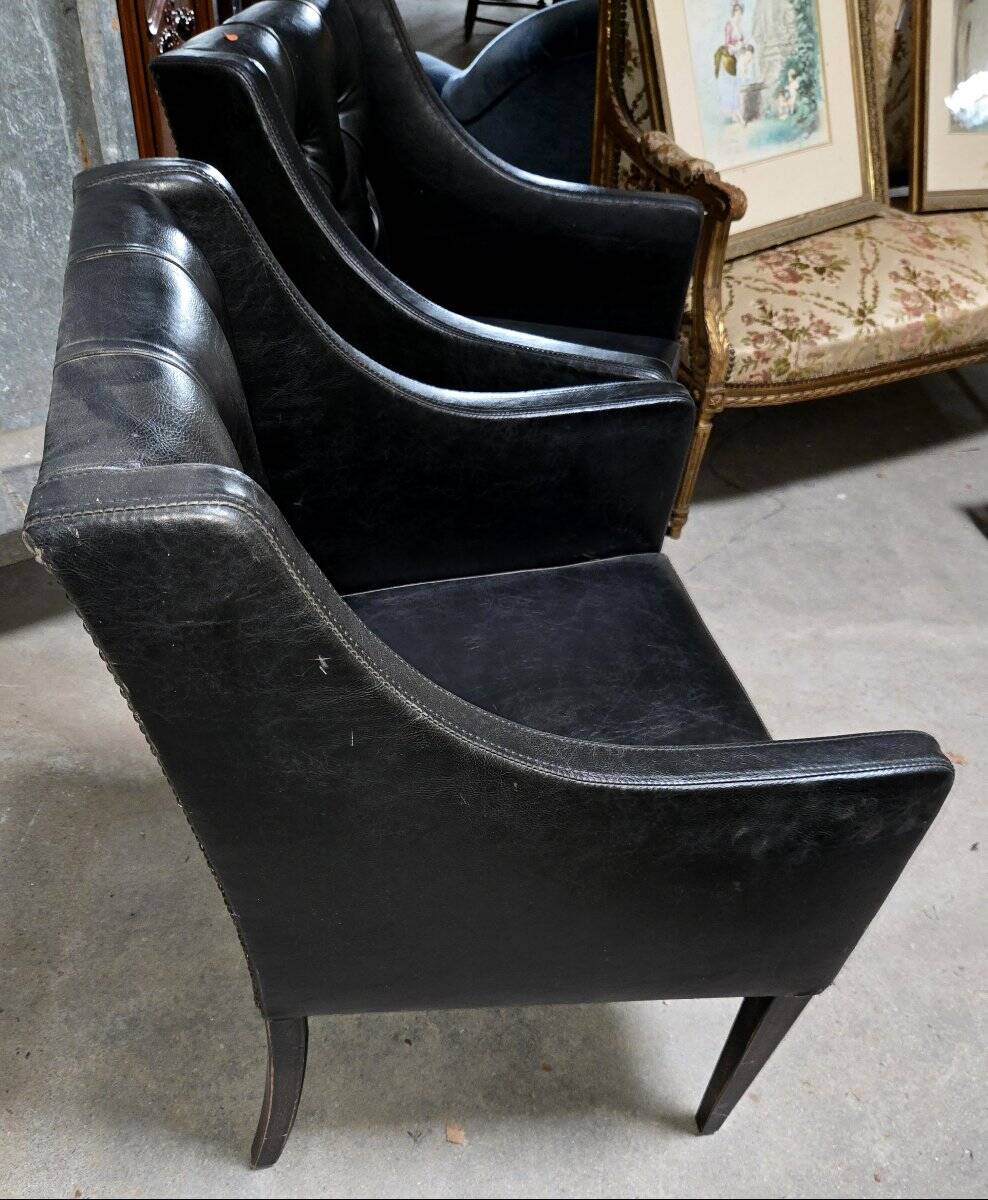 Paire de fauteuils en cuir noir, années 50