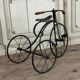 Children's tricycle made of wrought iron, around 1900.