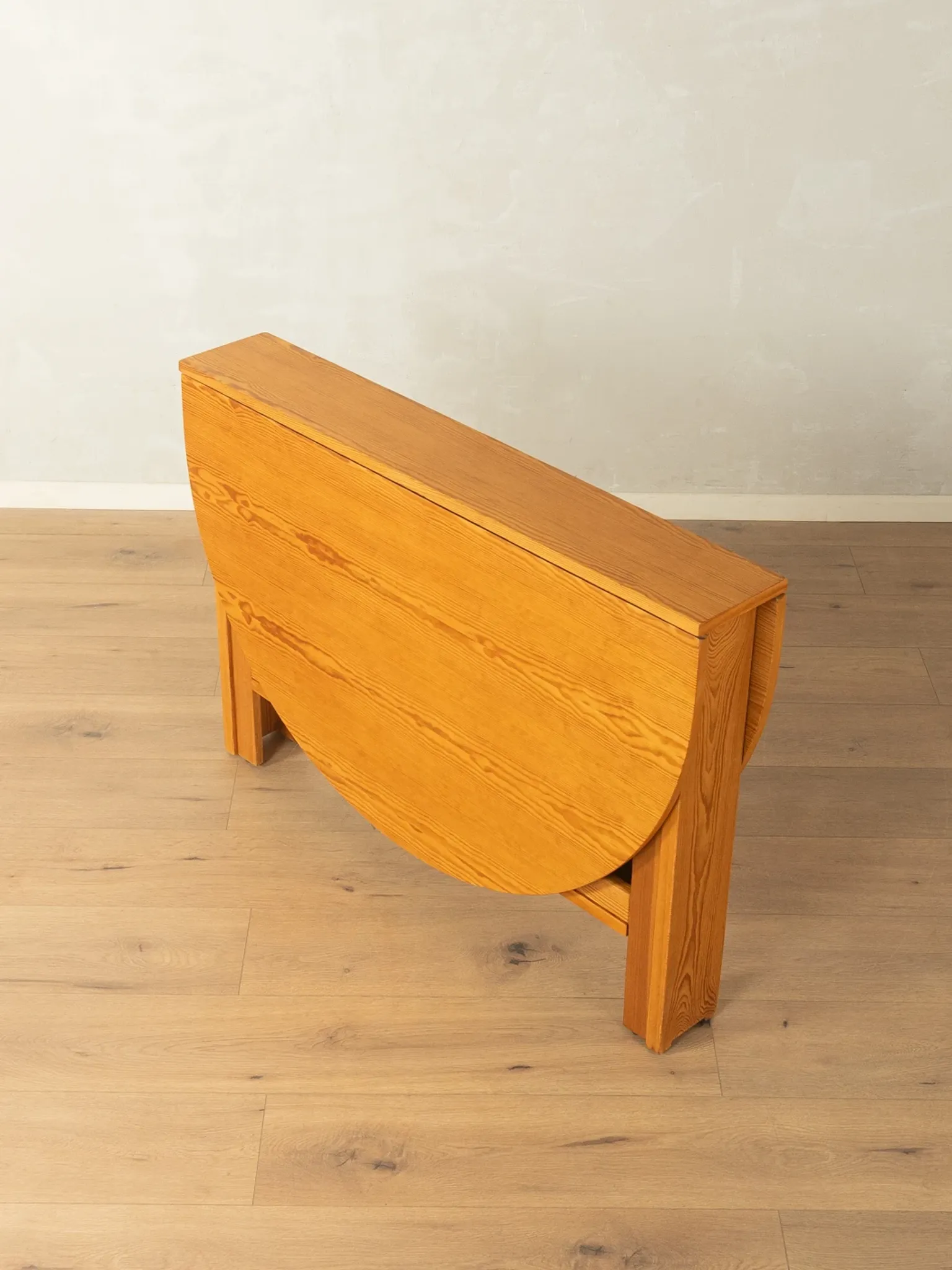 Practical folding table from the 1980s made of light brown pine wood