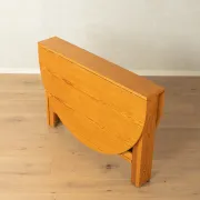 Practical folding table from the 1980s made of light brown pine wood