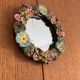 Round wall mirror in ceramic with slip-cast flowers, glazed, from the 60s/70s.