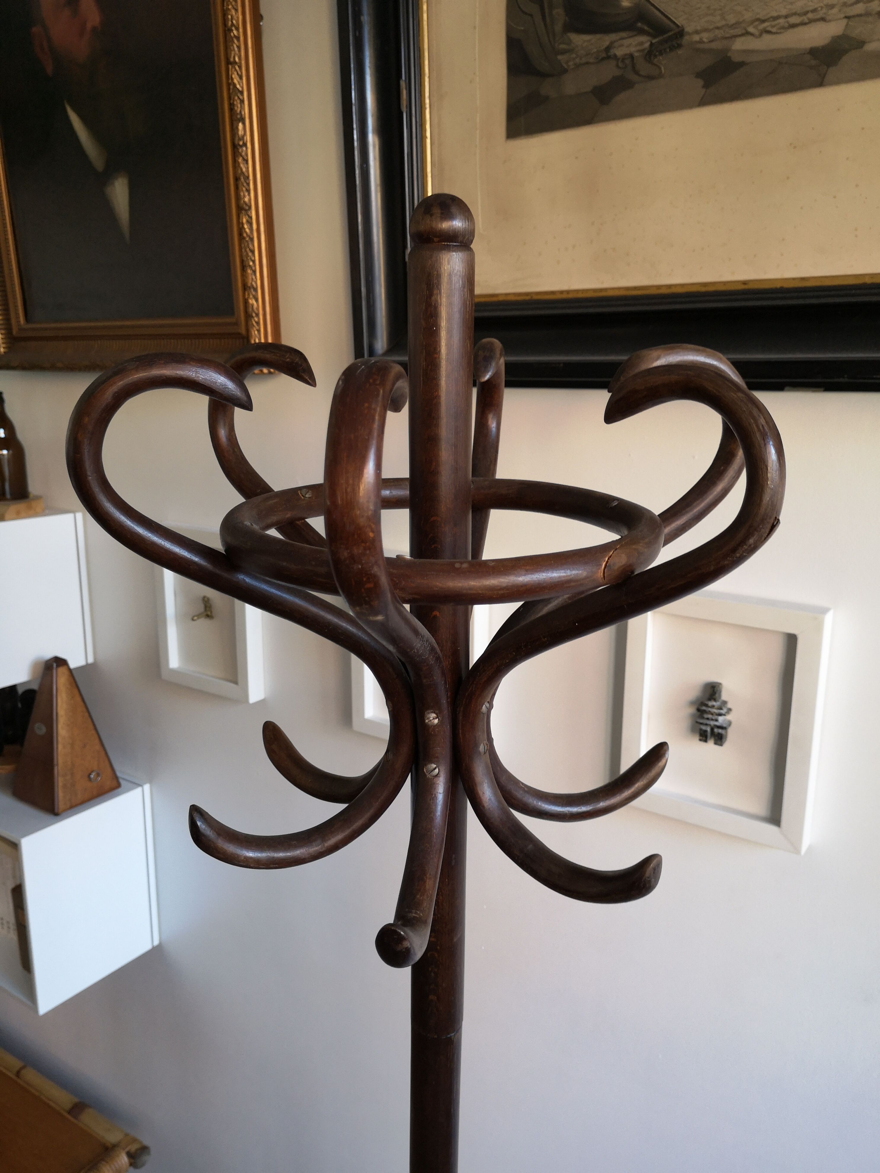 Dark wooden parrot coat holder