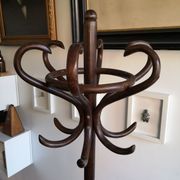 Dark wooden parrot coat holder