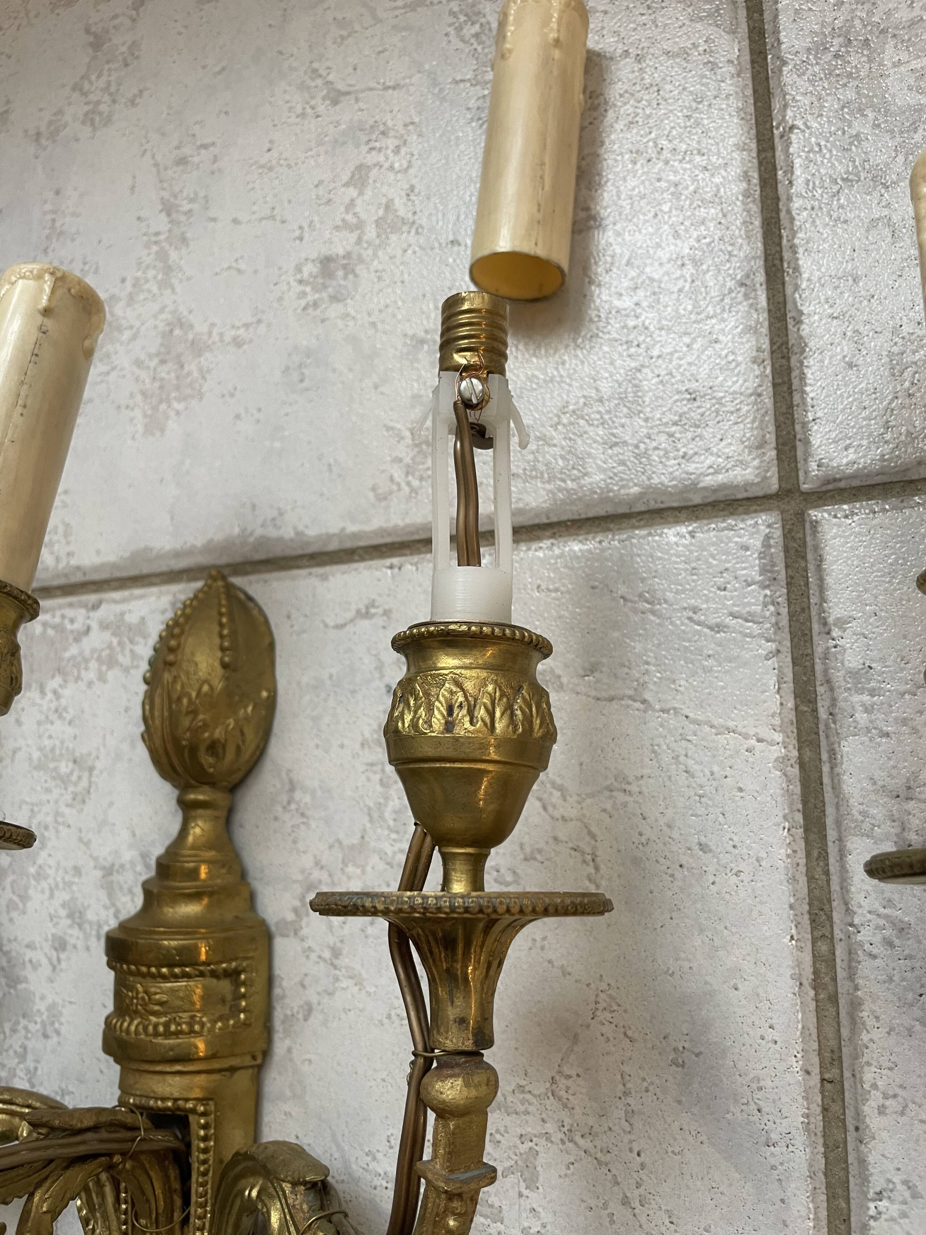 Pairs of Louis XVI bronze wall lamps