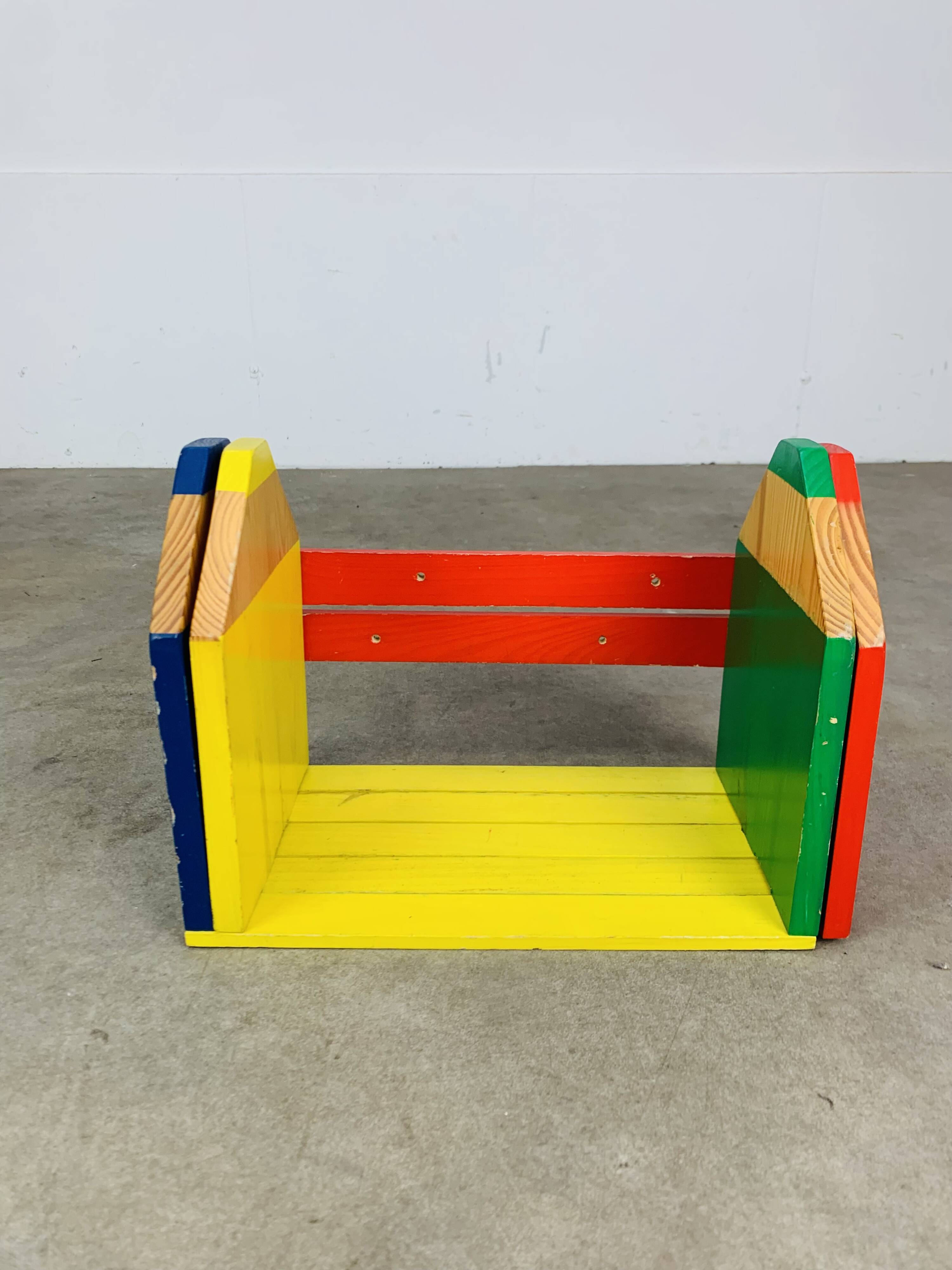 Modular wall-mounted pencil shelf in Pierre Sala style, for children.