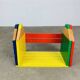 Modular wall-mounted pencil shelf in Pierre Sala style, for children.