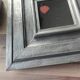 Vintage square mirror in wood covered with metal leaf, moldings in relief